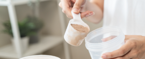 Powder being added to a shaker cup